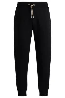 Tracksuit bottoms with signature-stripe cords